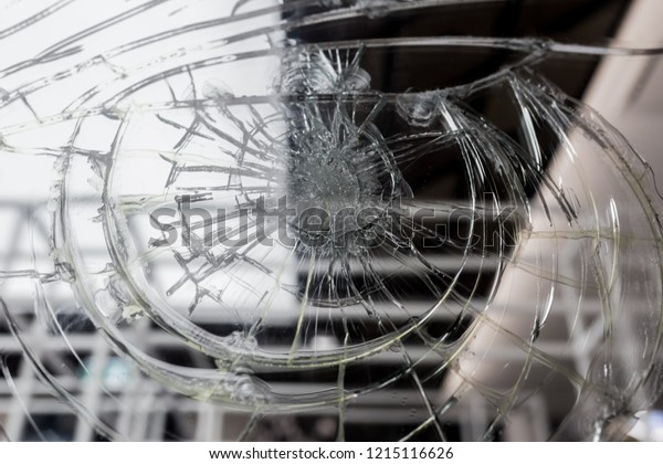 broken window glass in my office , broken\
glass background, black and white\
photo