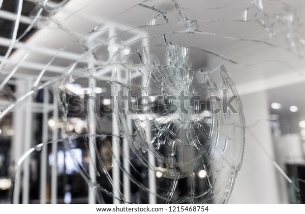 broken window glass in my office , broken\
glass background, black and white\
photo