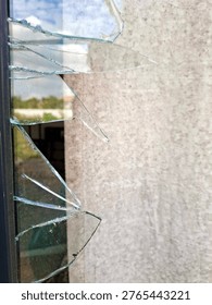 Broken Window Minimalist Desolate with sharp glass shards