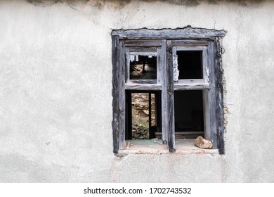 Broken window on the old abandoned building house in La Gomera, Spain. 