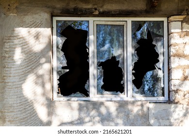 Broken window of residential home in close-up. Broken glass window outside . - Powered by Shutterstock