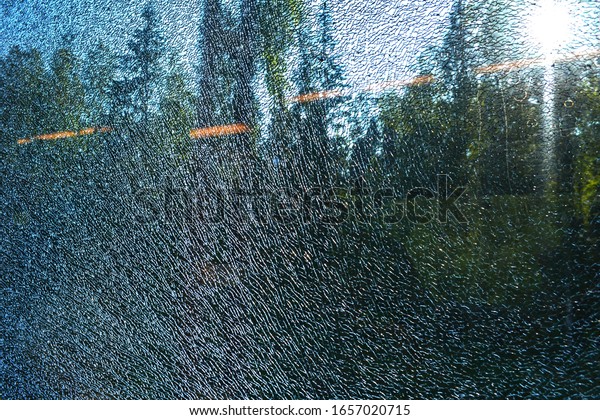 broken window in the train car Lastochka, forest\
throught the window