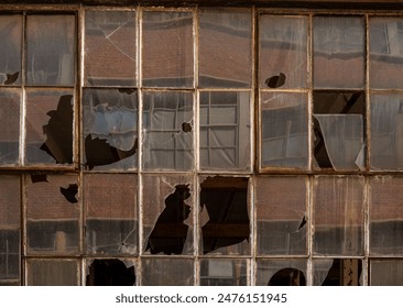 Broken windows of an abandoned factory, lost place - Powered by Shutterstock