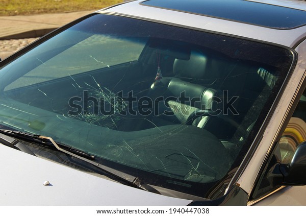 Broken windshield\
of a car after an\
accident.