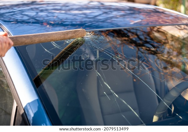 Broken windshield of a car with cracks. Car\
accident. Selective\
focus