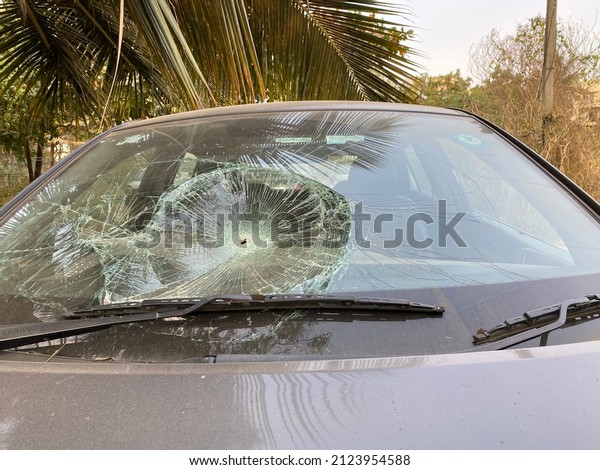 Broken windshield of a car, the broken and damaged\
car, Broken Auto Window