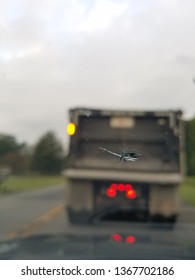 Broken Windshield Chip From Commercial Dump Truck