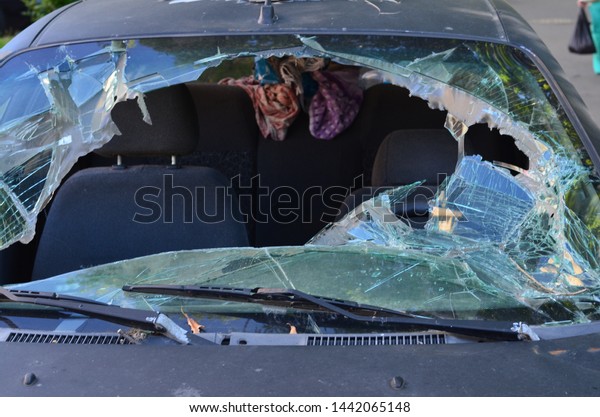 \
broken windshield of an old\
car
