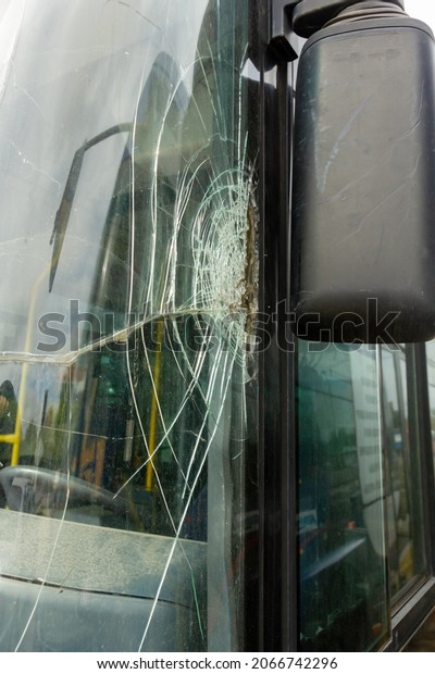 Broken windshield on a\
bus