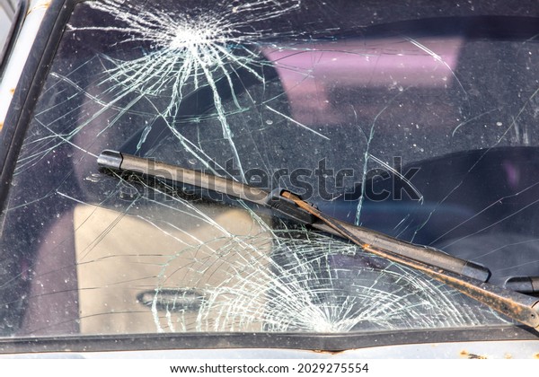 Broken windshield on a car.\
Accident