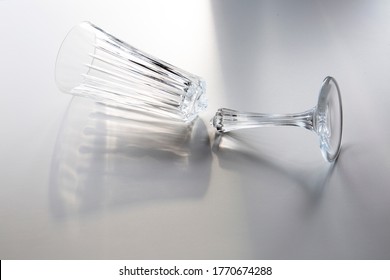 Broken Wine Glass Empty On White Background, Concept Of Collapse And Ruin