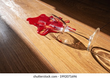 Broken Wine Glass On The Wooden Floor At Home. The Problem Of Alcohol Abuse, Alcoholic Anonymous, Concept Image.	