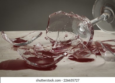 broken wine glass with red blood splash