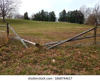 Broken Wood Fence With Green Grass Or Lawn