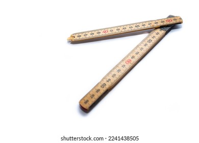 Broken wood metric folding ruler isolated on white background, space for text.
