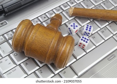 Broken Wooden Judge Gavel And Dices On Computer Keyboard. Breaking Online Gambling Laws And Rules Concept.