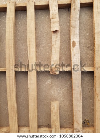 The broken wooden pallet.