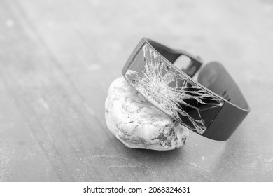 Broken Wrist Watch On Stone ,representing Lost Time Concept.