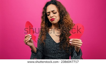 Brokenhearted young woman holds the pieces after break up, divorce