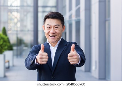 Broker Asian Businessman In Business Suit Happy Looking At Camera And Showing Thumbs Up