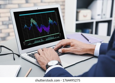 Broker Working With Laptop At Table, Closeup. Forex Trading