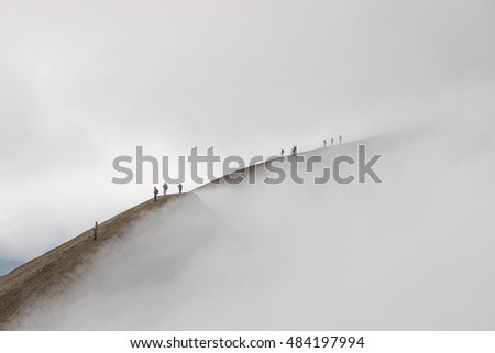 Similar – Image, Stock Photo Four people standing in a row on a ridge (2/2)