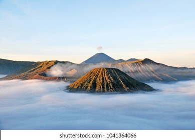 Bromo Mountain and fog around bromo mountain with sunrise from seruni viewpoint is an active volcano and part of the Tengger massif, in East Java, Indonesia. Indonesian call Gunung Bromo. Blue nature - Shutterstock ID 1041364066