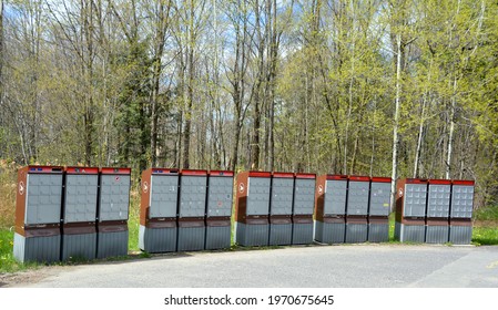 BROMONT CANADA 05 09 2021: Rows Of Receding Lockers With Metal Doors And Locks Of Outdoor Silver Canadian Mailboxes For Safe Delivery Of Rural Mail Post