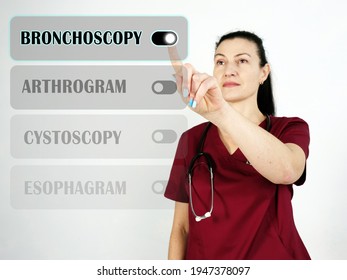  BRONCHOSCOPY text in menu. physician looking for something at cellphone.