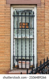 The Bronx, New York City, New York, USA. Beware Of Dog Sign On A Barred Window.