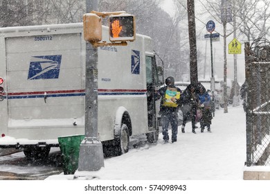 BRONX, NEW YORK - JANUARY 7: Mail Man Delivers Mail In Snow Storm.  Taken January 7, 2017 In New York.