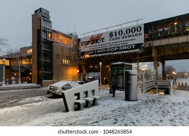 BRONX, NEW YORK - MARCH 7: Street Near Yankee Stadium Subway Station With Cop Shot Ad During Snow Storm.  Taken March 7, 2018 In New York.