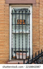 The Bronx, New York, USA. Beware Of Dog Sign On A Barred Window.