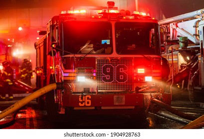 Bronx, New York USA January 28, 2021 Firefighters battle a 3 alarm fire in the Bronx that burned down seven stores. 