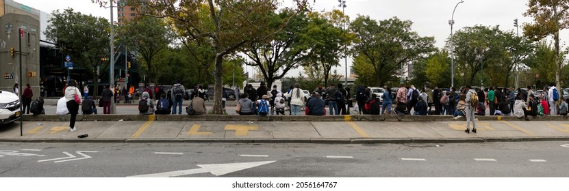 BRONX, NEW YORK, USA - October 5, 2021: Large Crowd Of People Wait For Public Bus Near Yankee Stadium. 