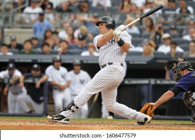 BRONX, NY - JUN 26: New York Yankees first baseman Mark Teixeira (25) hits a solo homerun against the Colorado Rockies on June 26, 2011 at Yankee Stadium. 