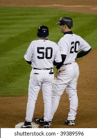 BRONX, NY - OCTOBER 17: Jorge Posada (#20) Talks With First Base Coach Mike Kelleher (#50) During Game Two Of The ALCS At Yankee Stadium On October 17, 2009 In The Bronx, NY.