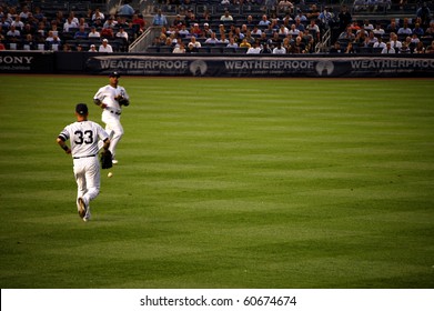 BRONX, NY - SEPTEMBER 7: The Ball Falls Between Yankees' 2B Robinson Cano And RF Nick Swisher For An Orioles Hit On September 7, 2010 In Bronx, NY.