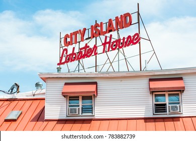 Bronx, USA - June 11, 2017: Restaurant sign in City Island called Lobster House on the water waterfront during day