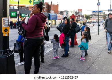 Bronx, USA - October 27, 2017: People Family Waiting To Cross Street In Fordham Heights Center, New York City, NYC In Evening