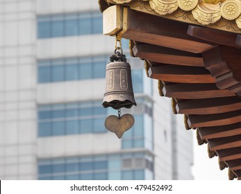 bronze bell in buddhist temple, the Chinese characters on bell mean pray for peace.