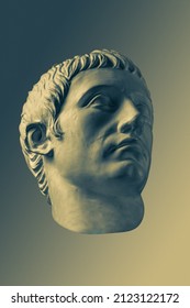 Bronze color gypsum copy of ancient statue of Germanicus Julius Caesar head for artists on brass background. Renaissance epoch. Plaster sculpture of man face. Template for art design