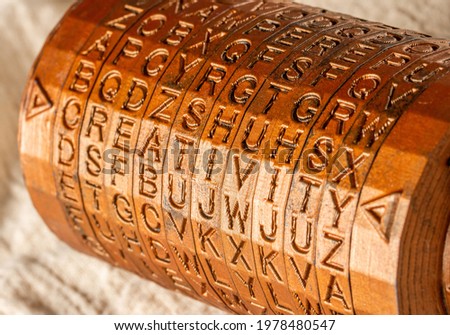 Bronze cryptex invented by Leonardo da Vinci from the book da vinci code. Word creativity as password set by letters rings. Cryptographic equipment printed on a 3D printer.