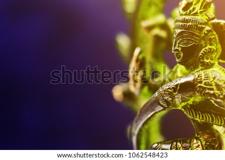 Bronze dancing Shiva. Toned photo with copy space