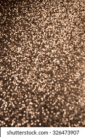 Bronze Glitter Background In Defocus Abstract