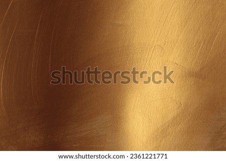 Bronze and gold ink smear brush stroke stain blot glow texture wall background.