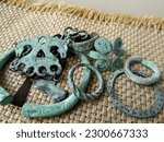 Bronze jewelry of the Slavs of Kievan Rus of the 8th-11th centuries, ancient bronze rings, bracelets, pendants, amulets and chains of the early Slavs against the background of coarse fabric