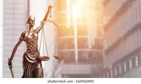 Bronze lady with scale, symbol of justice and law - Shutterstock ID 1669363903