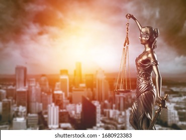 Bronze Lady With Scale, Symbol Of Justice And Law On City Background