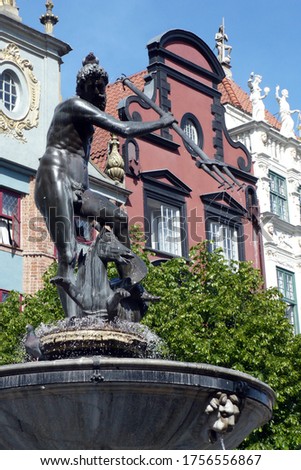bronze monument Tryton fountain in Gdansk Poland monument on the market tourist attraction famous, travel, visit, pigeon on his head bird
